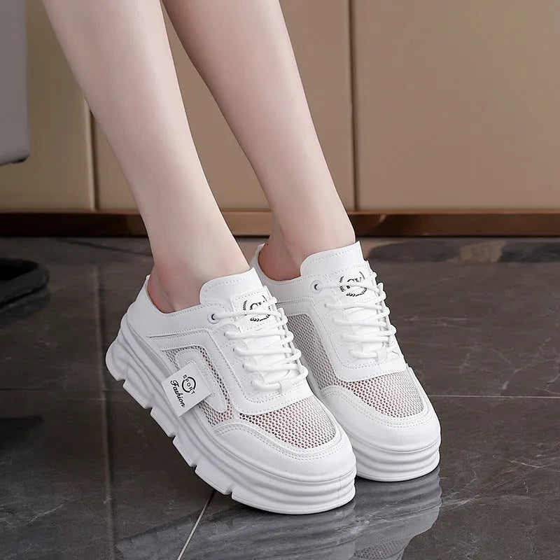Women's black breathable mesh half slippers with round toe and rubber sole on a white background.