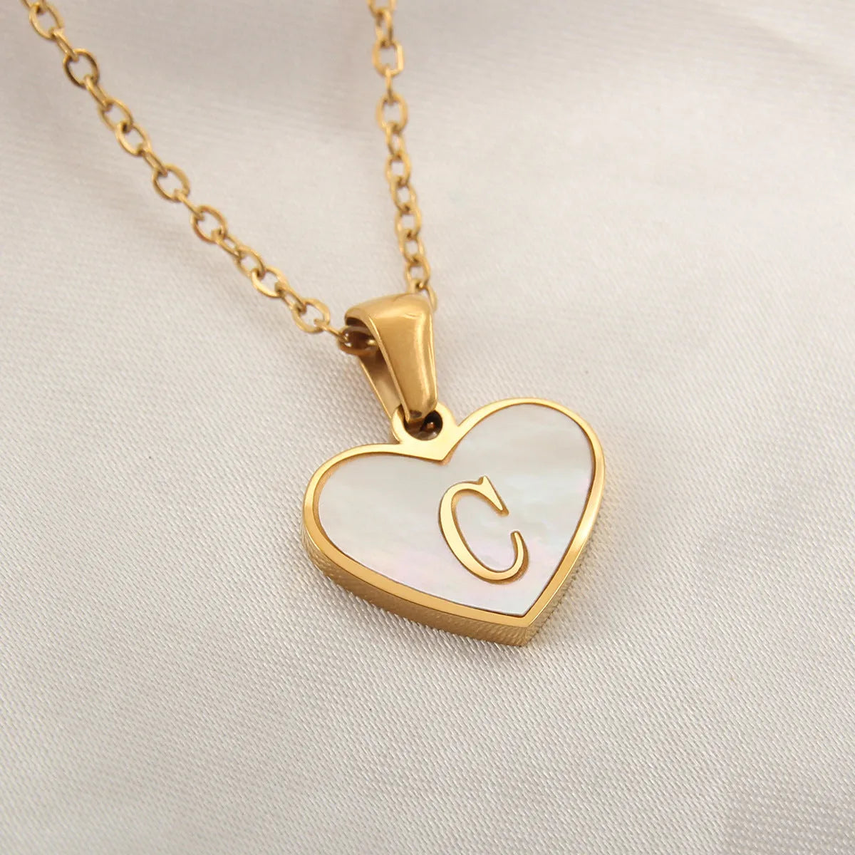 Gold plated personalised heart necklace with white shell on a 45cm chain
