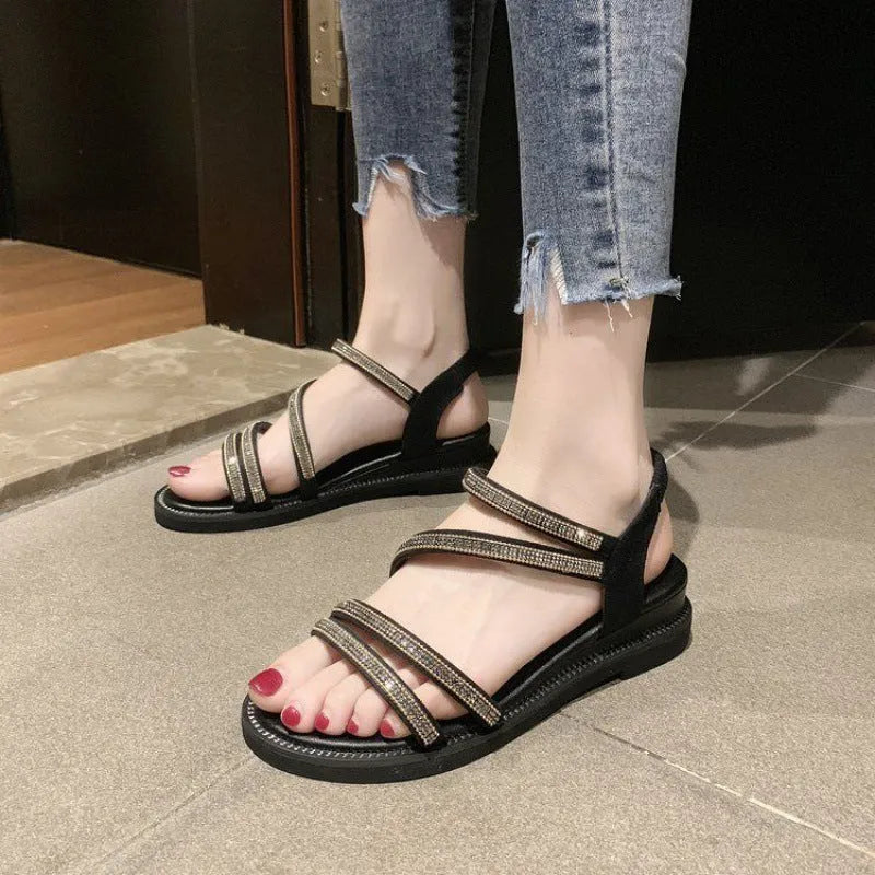 Women's gold Korean style flat sandals with rhinestone fairy details and an elastic strap.