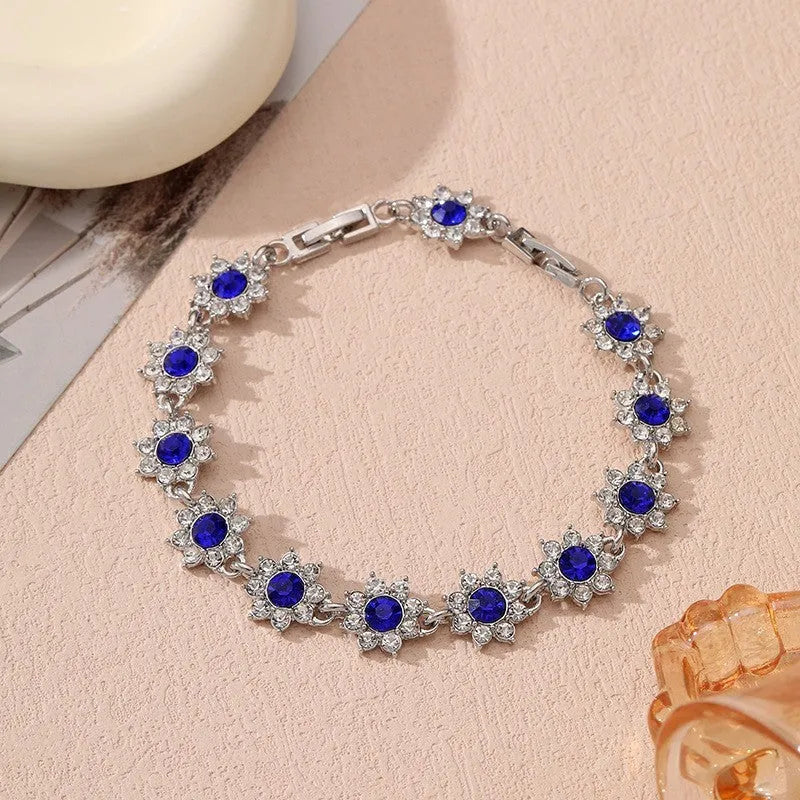 Floral-shaped zinc alloy bracelet with electroplated finish in gold and silver colour options.