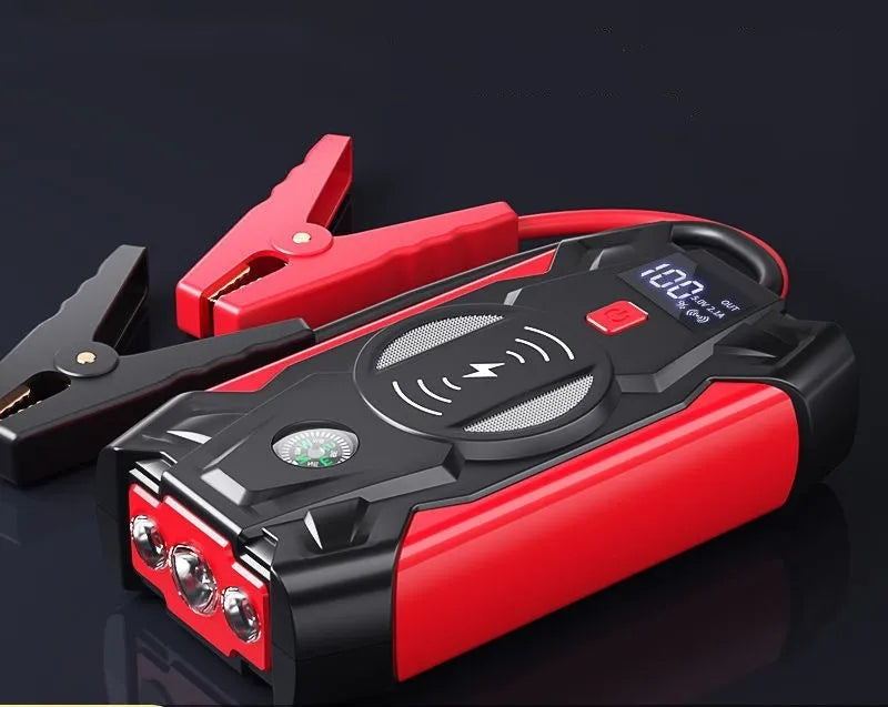 Red car emergency jump starter power pack with crocodile clips and digital display screen