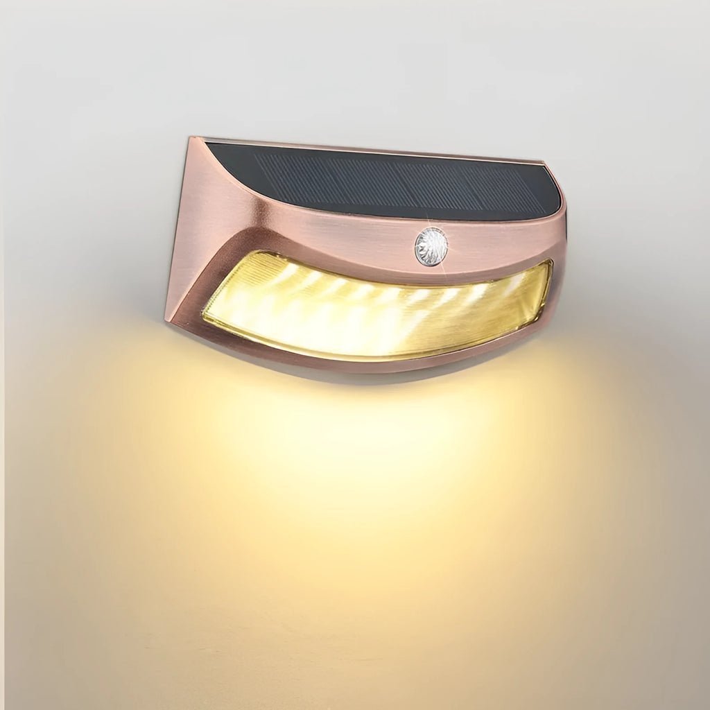 Solar-powered outdoor wall lamp with a smiling face design in warm or white light.