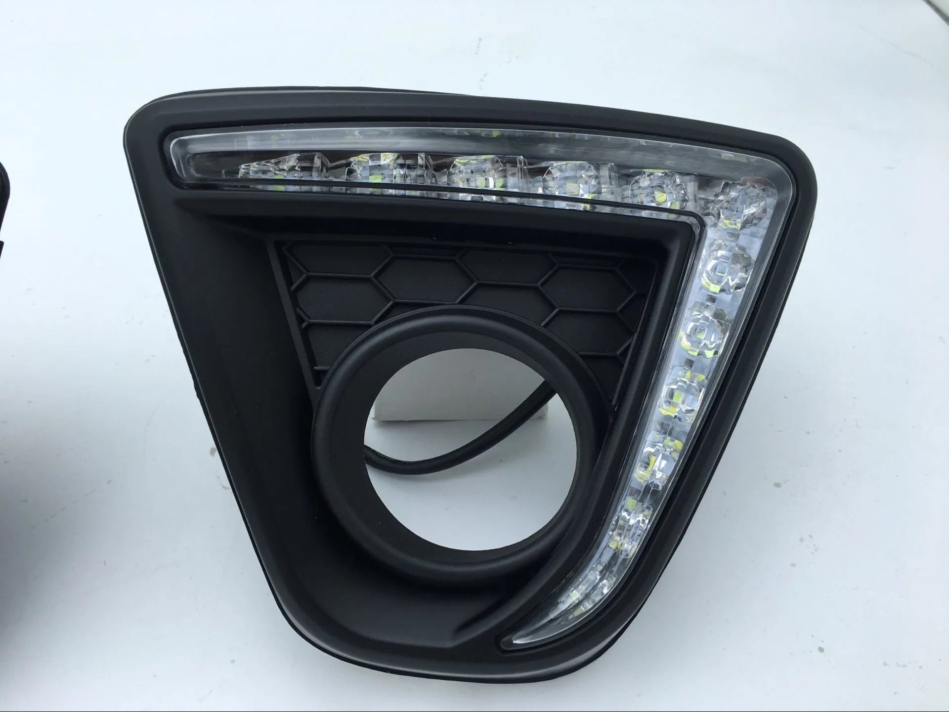 Mazda CX-5 daytime running light LED lamp unit with electroplated housing.