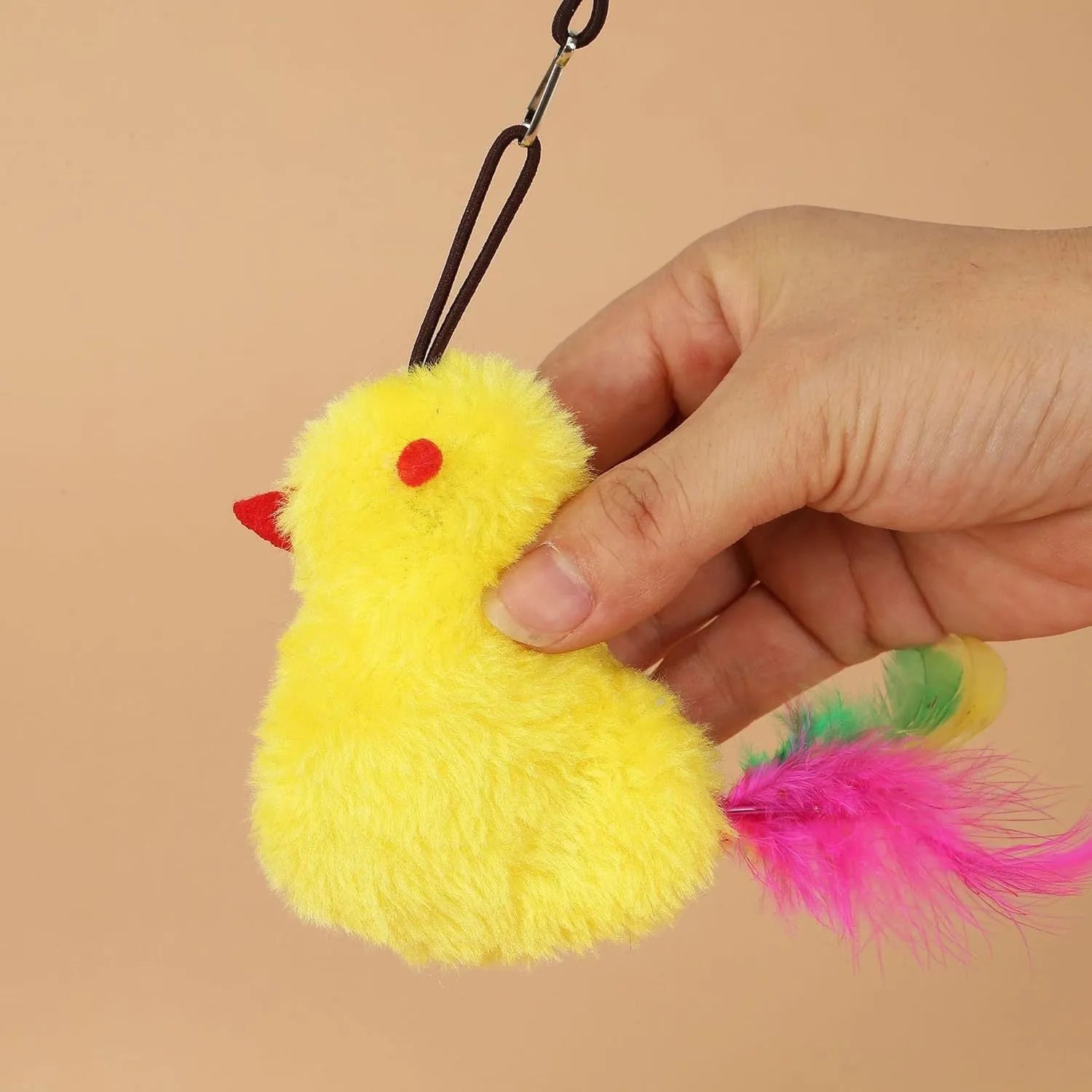 Interactive hanging cat toy with retractable elastic rope and dangling mouse attachment on door frame