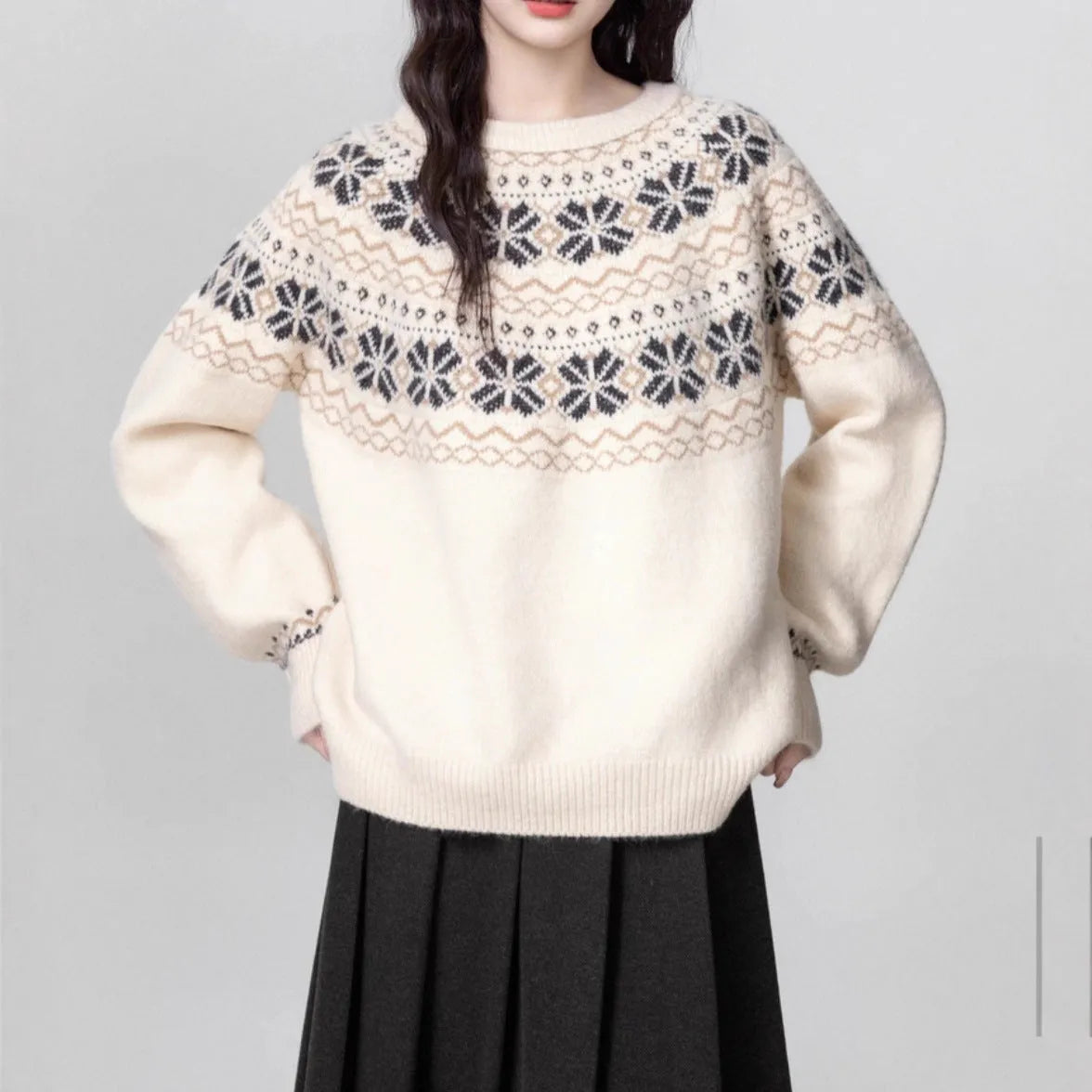 Women's loose-fit Fair Isle pullover sweater with white geometric knit pattern, crew neck, and long sleeves.