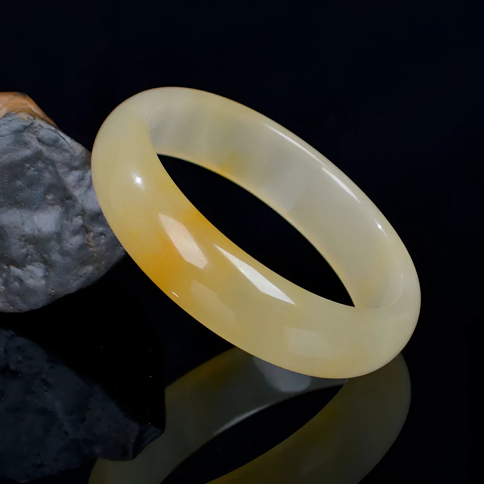 Natural light jade bracelet with Chinese styling in polished gemstone finish showing adjustable sizing from 54mm to 62mm