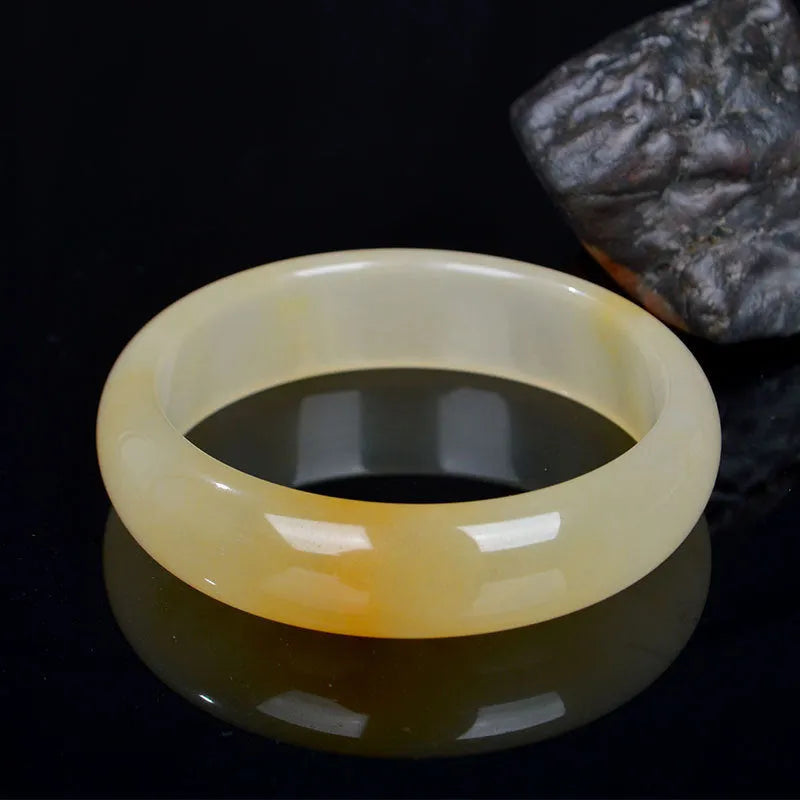 Natural light jade bracelet with Chinese styling in polished gemstone finish showing adjustable sizing from 54mm to 62mm