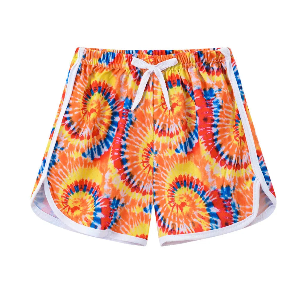 Children's polyester beach shorts in various colours and patterns including stripes, prints and solid options