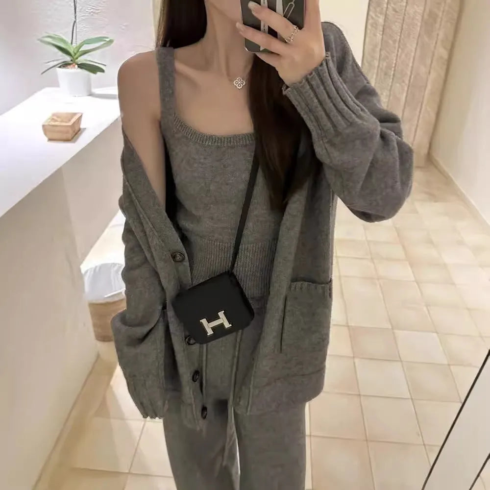 Women's loose fit wool blend cardigan three-piece set in beige, showing vest, coat, and casual pants.
