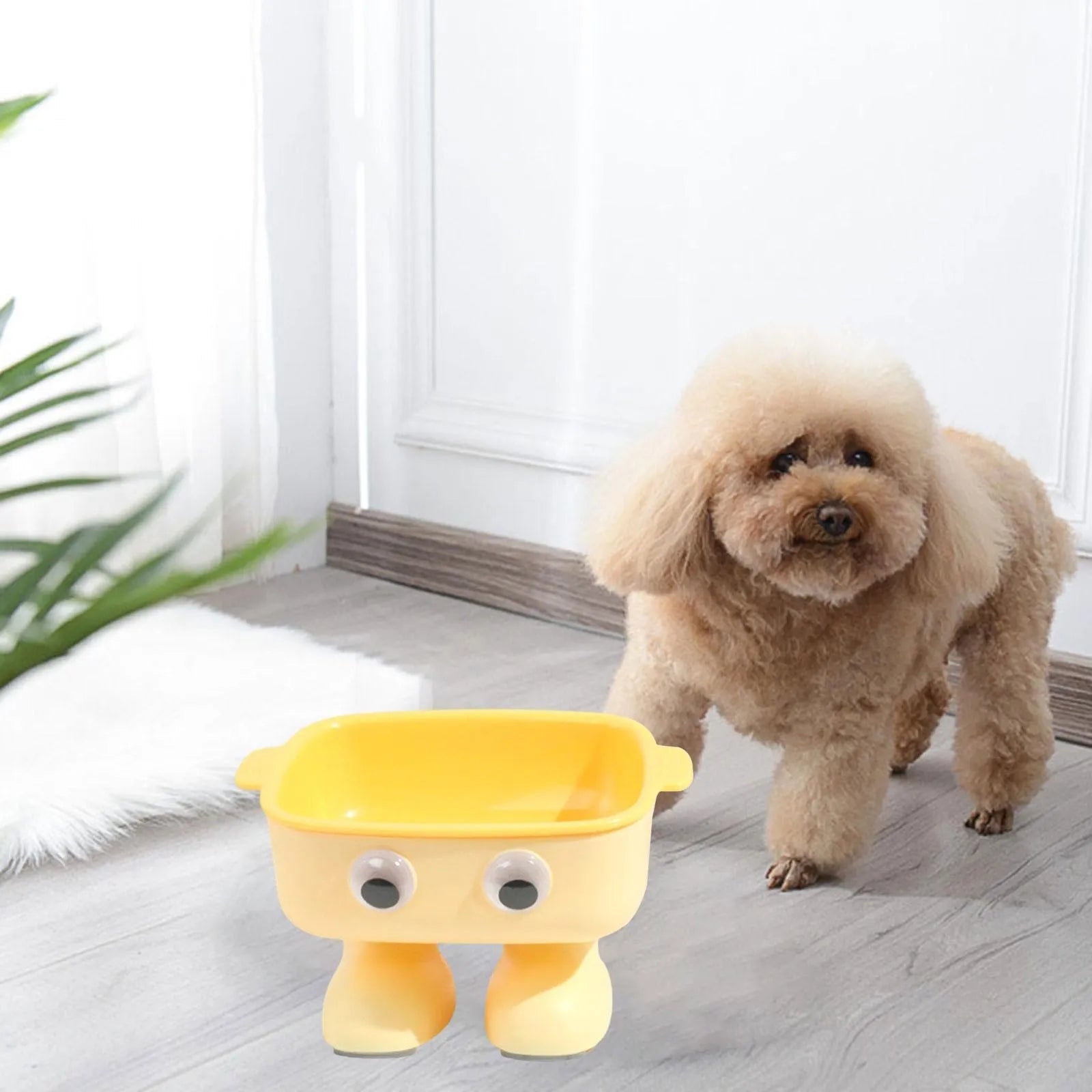 Green robot-shaped elevated cat bowl with tilted dish and anti-slip base.