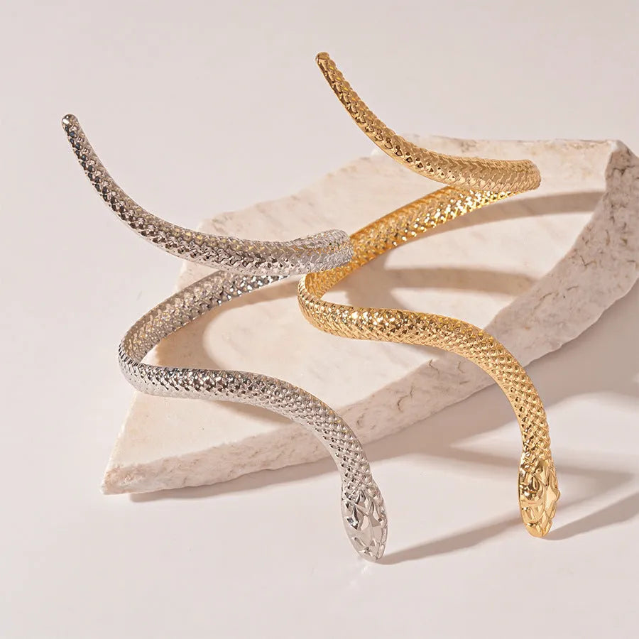 Gold and silver exaggerated twisted snake design ring and bracelet jewellery set