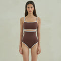 Brown triangle one-piece swimsuit for women on a hanger, showing front design.