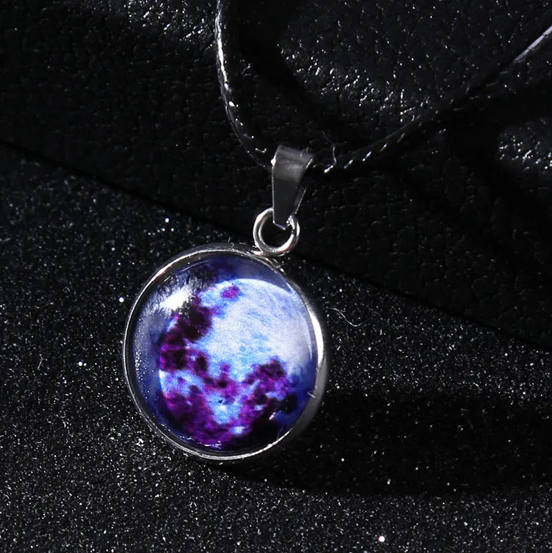 Luminous moon and constellation design pendant on an alloy necklace chain with extension.