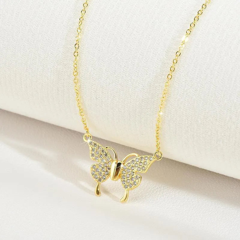 Gold titanium steel clavicle chain with magnetic butterfly closure and twisted chain design