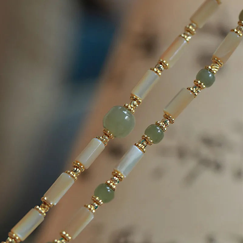 Natural Hetian Jade white lip shell bracelet for women with round beads and geometric design