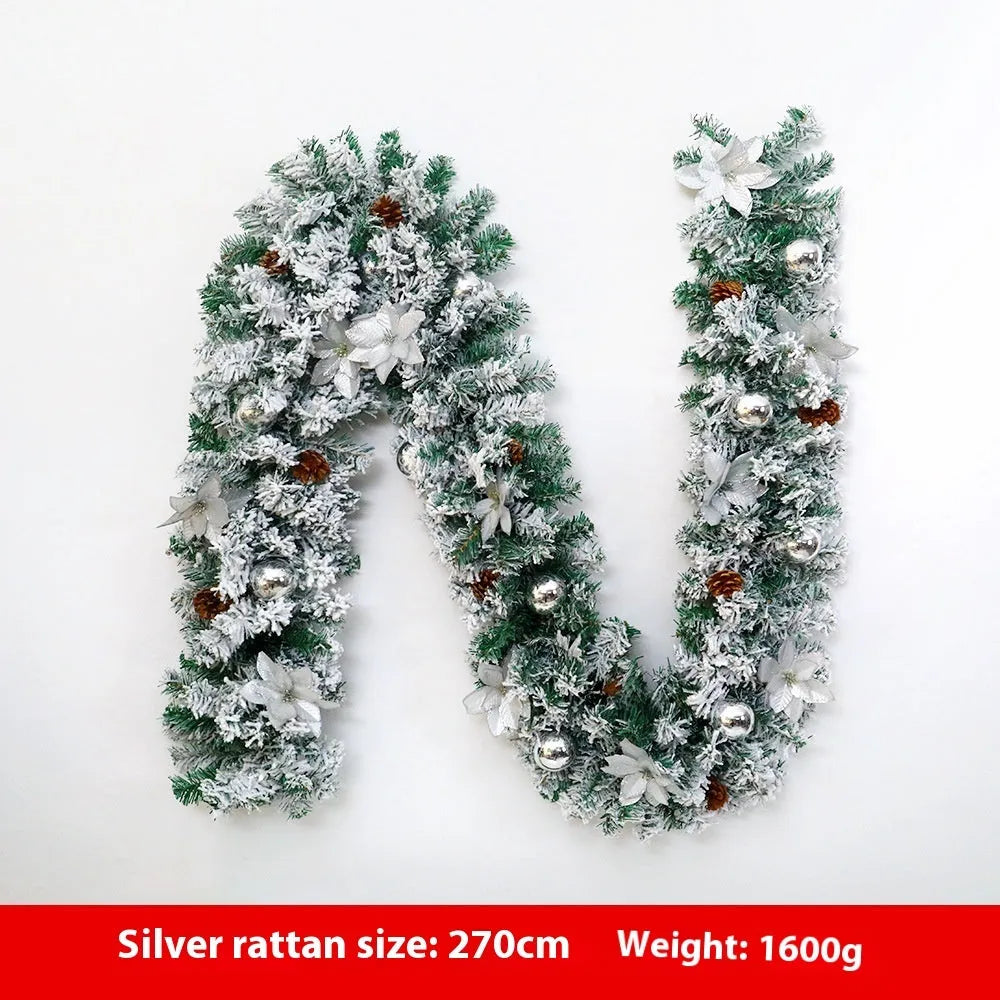 Christmas rattan garland decoration with flocked texture in five colour options displayed draped