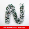 Christmas rattan garland decoration with flocked texture in five colour options displayed draped