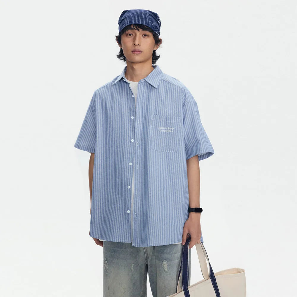Blue striped short-sleeved overalls shirt with loose cardigan fit on hanger