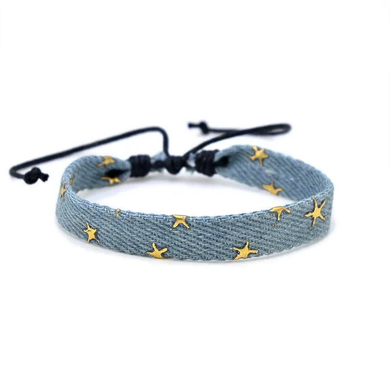 Handmade denim fabric wristband carrying strap in mixed materials with adjustable closure