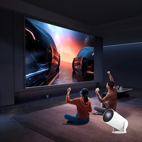 White Barrel X10 PLUS portable projector with gamepad and remote control on table