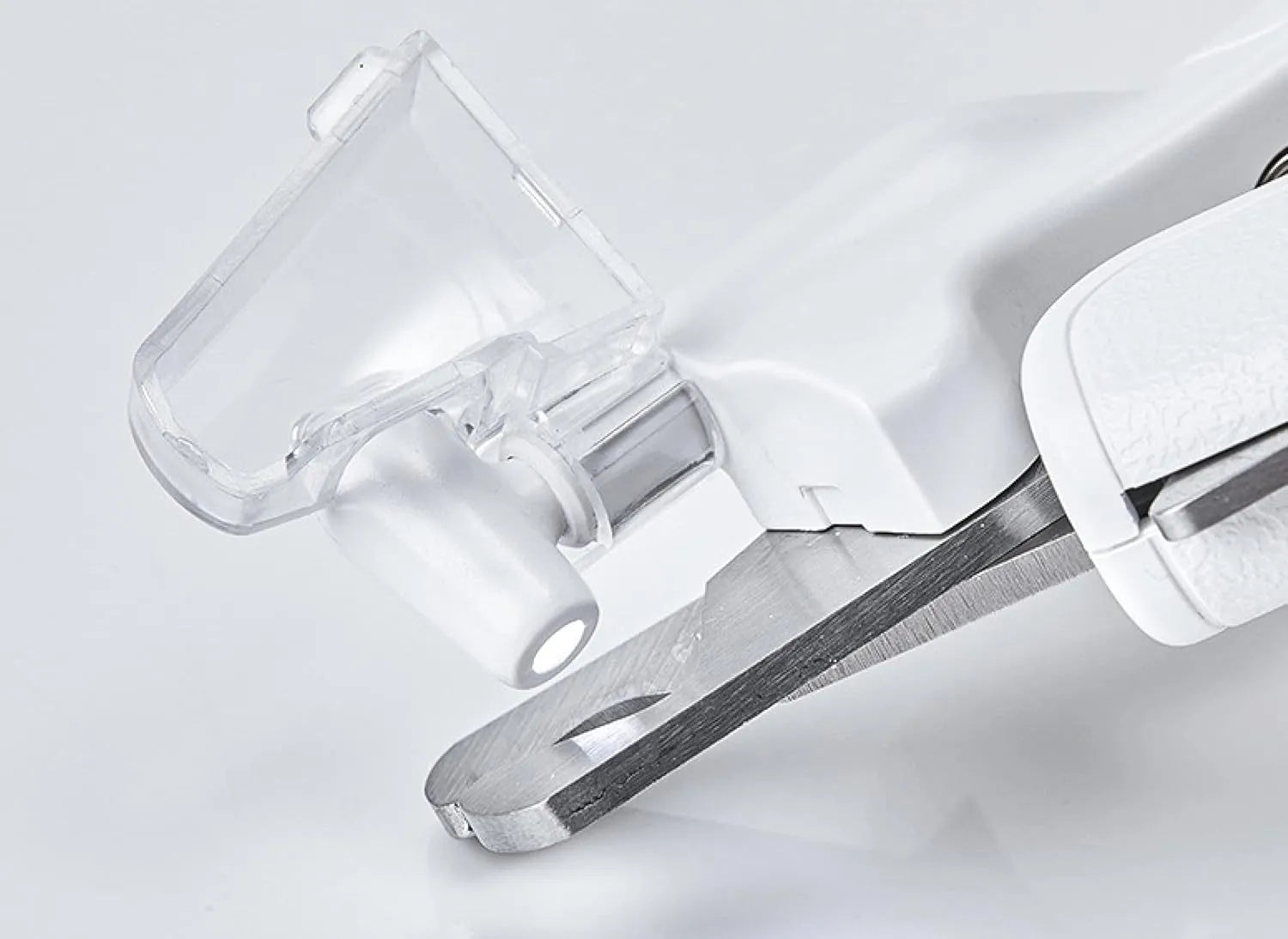 White pet nail clippers with LED light, transparent anti-splash baffle, and a nail file.