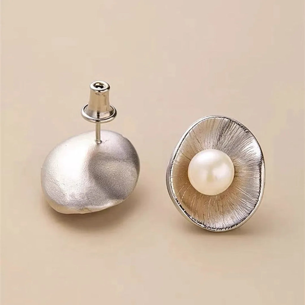 Gold tone geometric pearl stud earrings with sterling silver posts