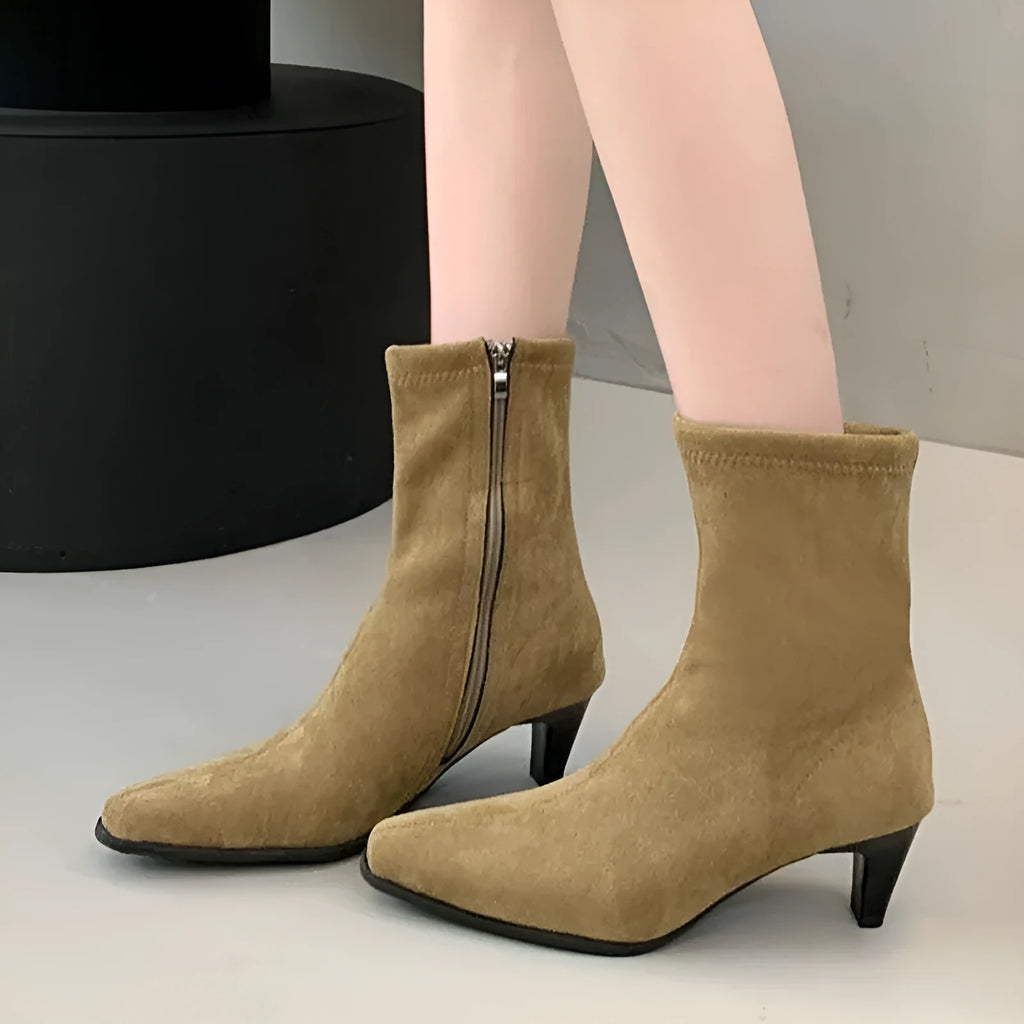 Brown square toe ankle boot with side zip and a mid-height stiletto heel on a waterproof platform sole.