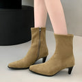 Brown square toe ankle boot with side zip and a mid-height stiletto heel on a waterproof platform sole.