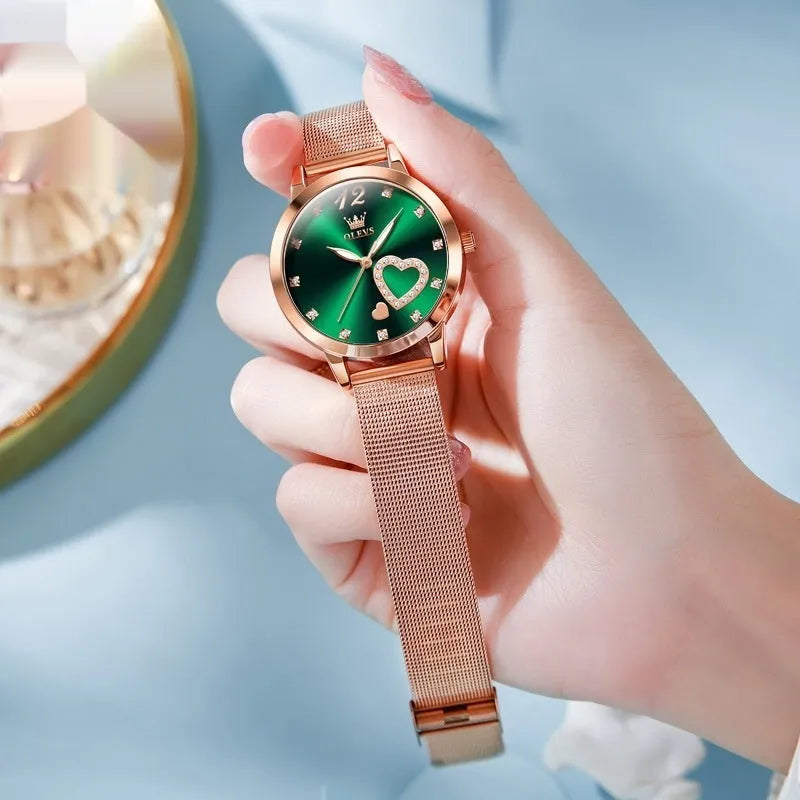 Women's rose gold fashion watch with mesh strap showing choice of six dial colours: white, black, blue, red, pink, green.