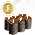 Four black LED pillar candles with flickering flame effect, shown together