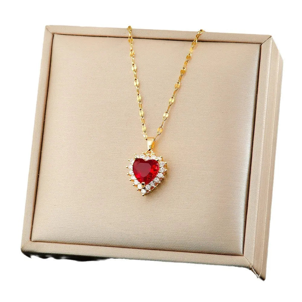 Gold red titanium steel jewellery set with hearts and flower pendant including necklace, ear studs, and ring