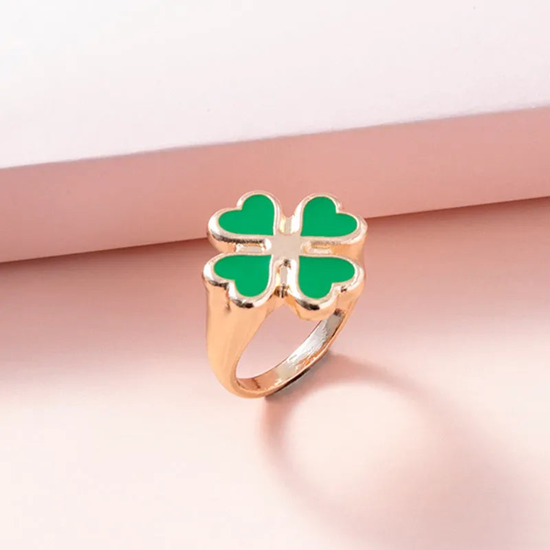Four leaf clover ring in silver colour with enamel detailing on zinc alloy band, 17mm size