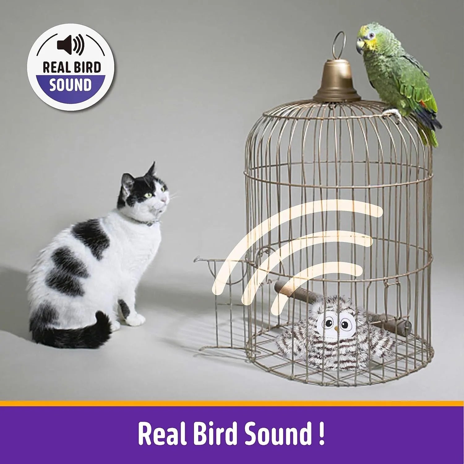 Grey plush owl automatic cat toy with beating wings on flat surface with USB charging cable