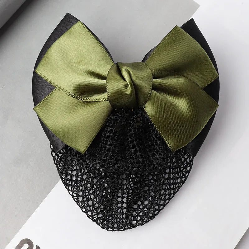 Professional hair clip with a black net pocket and a red flower bow ornament on a white background.