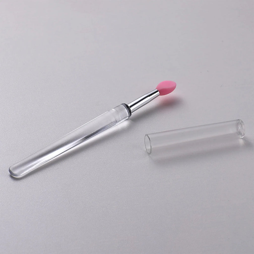 Set of reusable silicone lip brushes with protective caps in various colours.