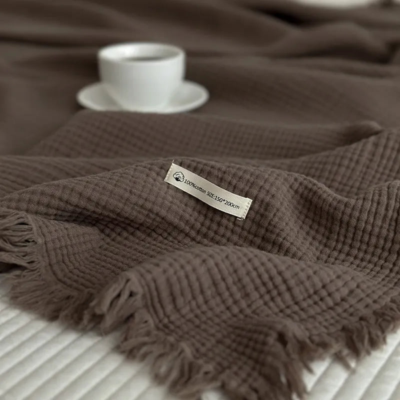 Four-layer gauze cotton blanket with tassel detailing in navy blue colour option