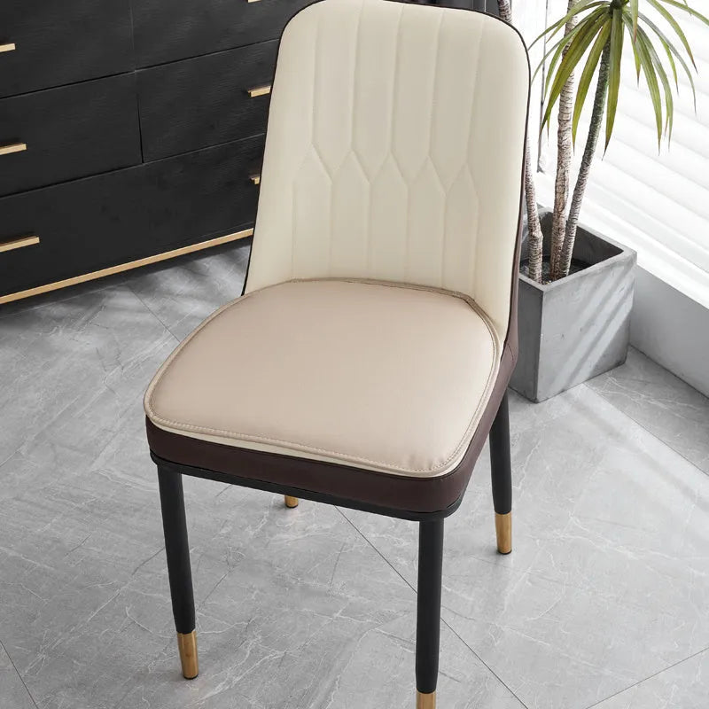 Horseshoe-shaped PU leather seat cushion in orange, shown on a chair.