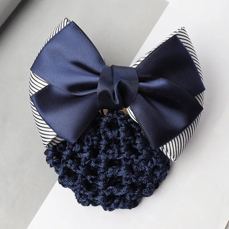 Professional hair clip with a black net pocket and a red flower bow ornament on a white background.