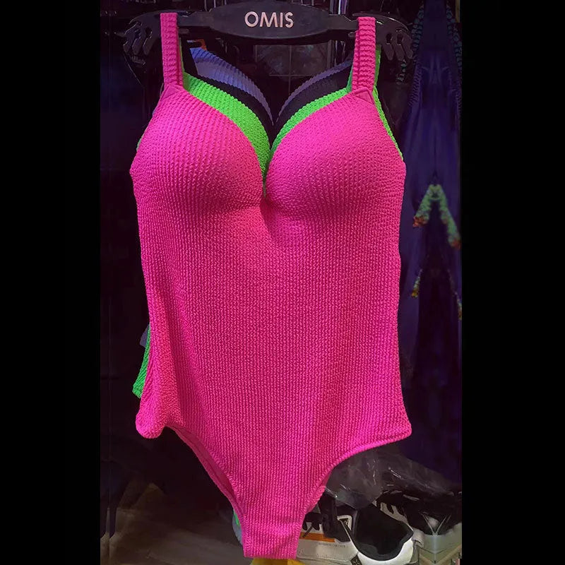 Women's one-piece swimsuit with sunken stripe pattern in polyester fabric, shown in multiple colour options