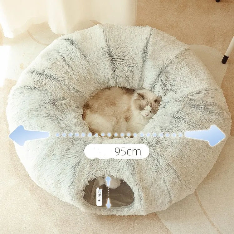 Closed cat tunnel nest 95cm made of long fluffy plush in rainbow colour on a wooden floor