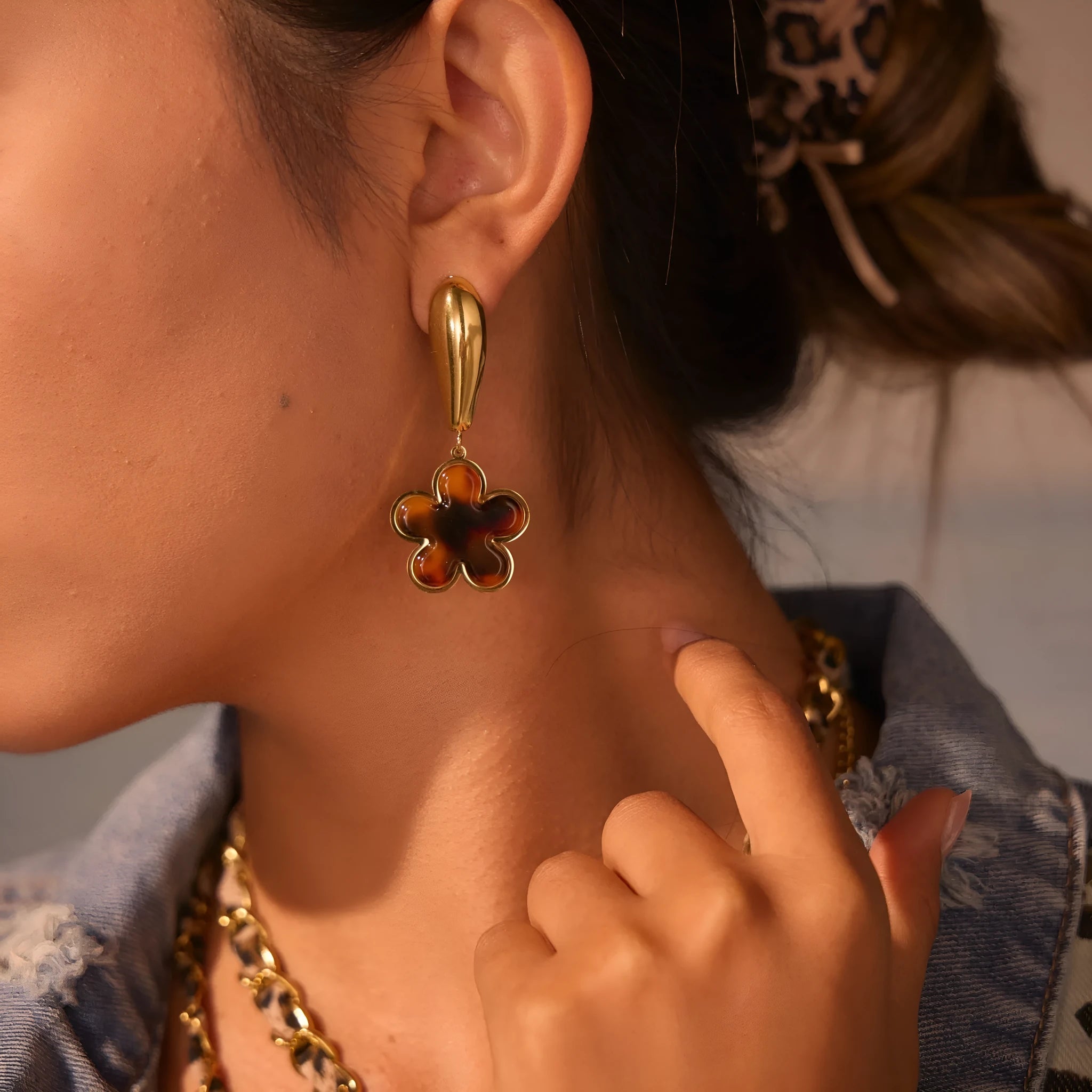 Tortoiseshell resin hawksbill colour earrings with 18K gold electroplating, showing heart-shaped and flower geometric designs
