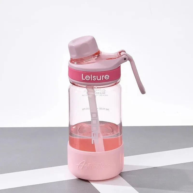 Heat-resistant plastic drinking cup in grey green or pink with cartoon pattern
