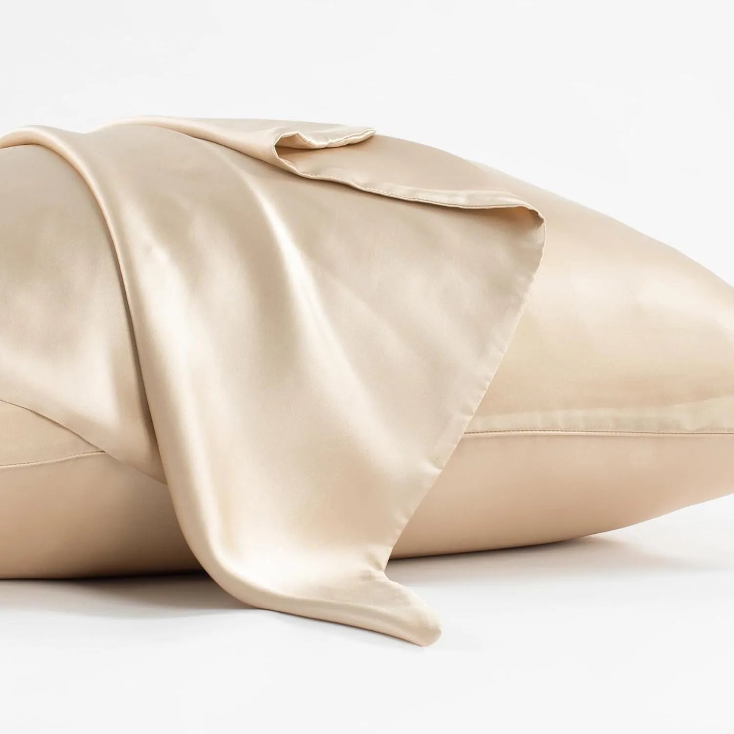 Dark grey silk pillowcase with envelope closure on a bed