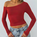 Women's solid colour knitted cardigan with cross shoulder straps and long sleeves