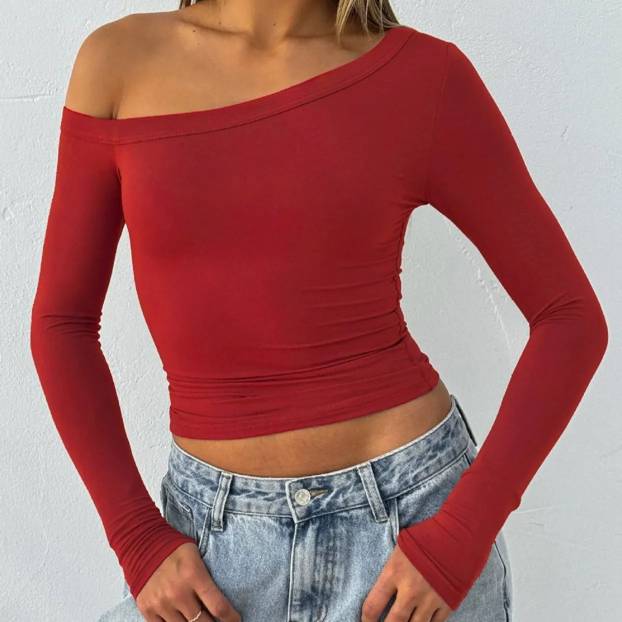 Women's solid colour knitted cardigan with cross shoulder straps and long sleeves