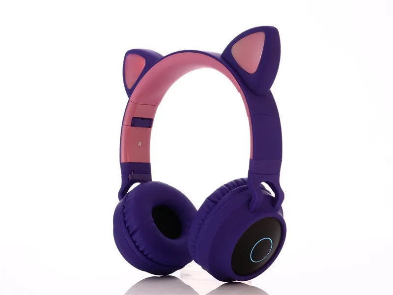 Pink cartoon cat ear wireless Bluetooth headset with headband, shown on a white background.
