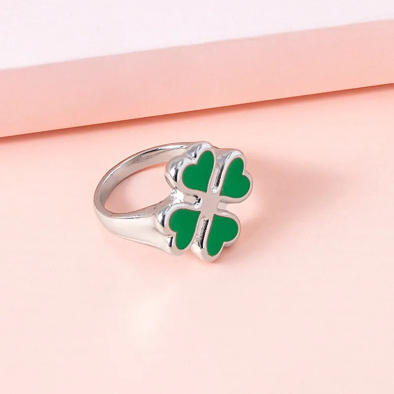 Four leaf clover ring in silver colour with enamel detailing on zinc alloy band, 17mm size