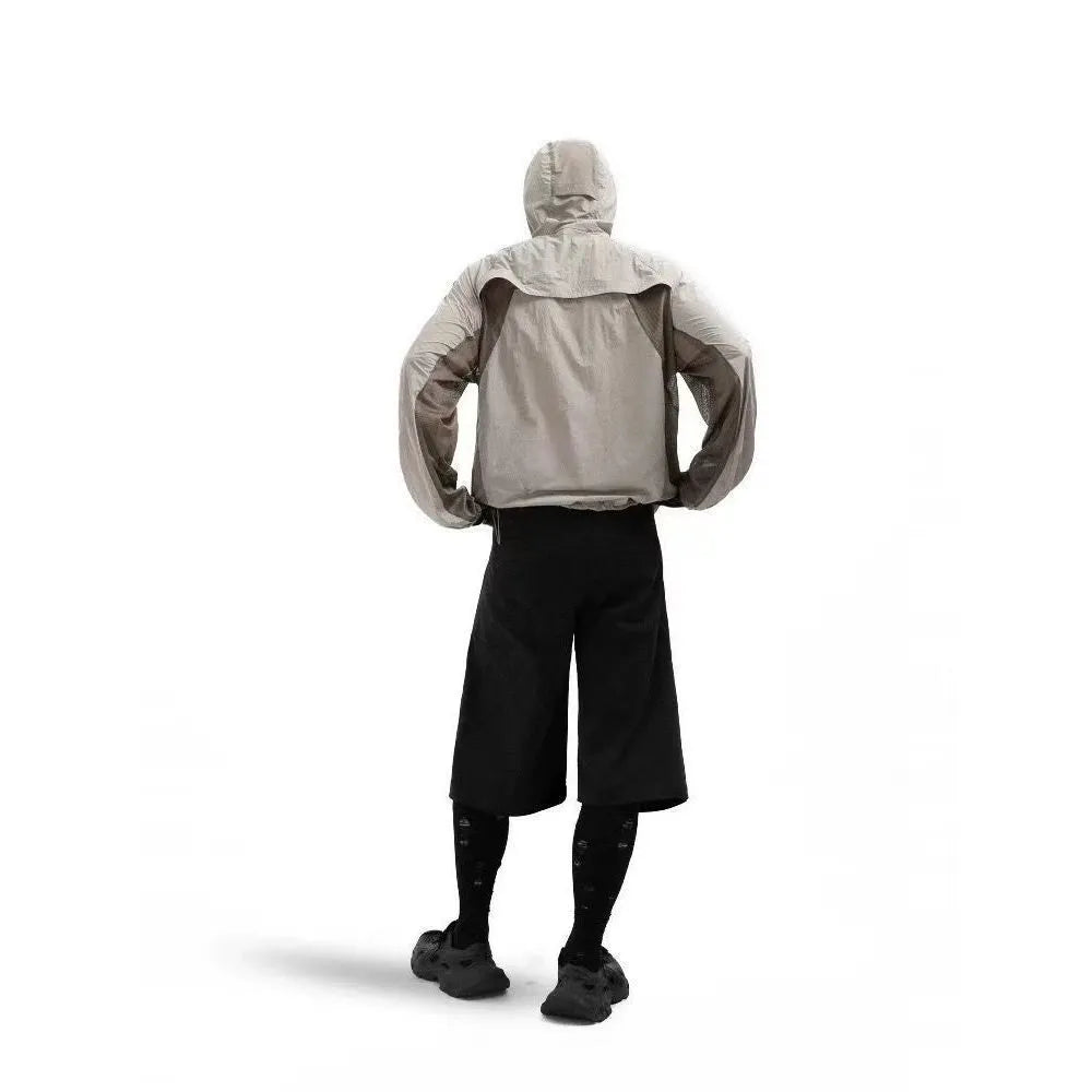 Mesh-stitched sun protective clothing in desert brown, thin nylon fabric for UV protection.