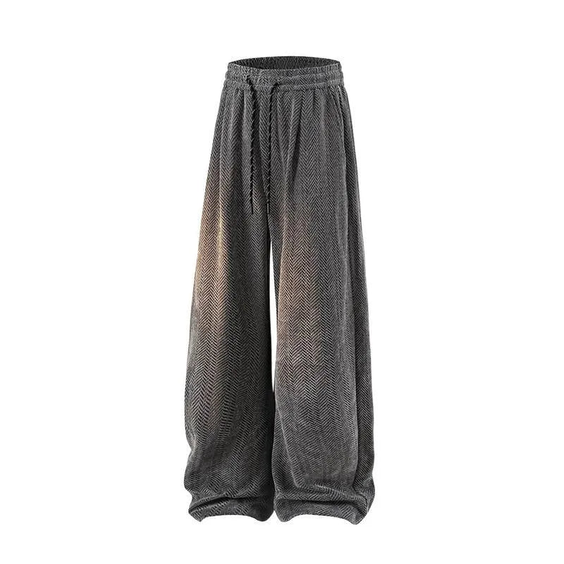 Fleece-lined straight-leg hollow-out trousers in light gray on a hanger, showing elastic waistband and textured fabric.