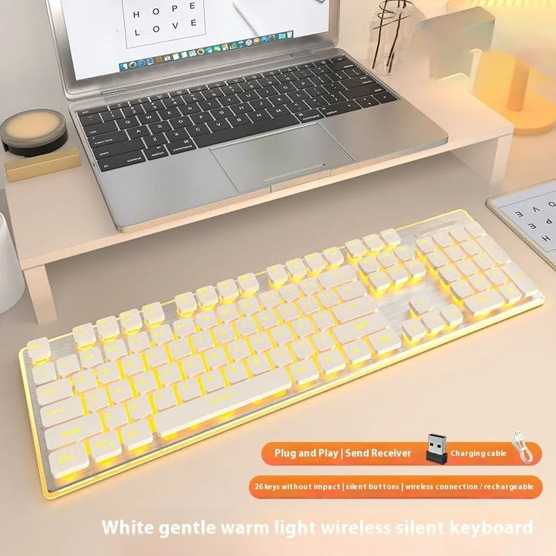 Wireless Bluetooth keyboard with ice blue backlight and mute button, shown in cherry blossom pink colour.